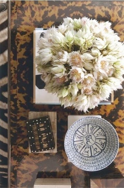 coffee table flat lay with floral arrangement